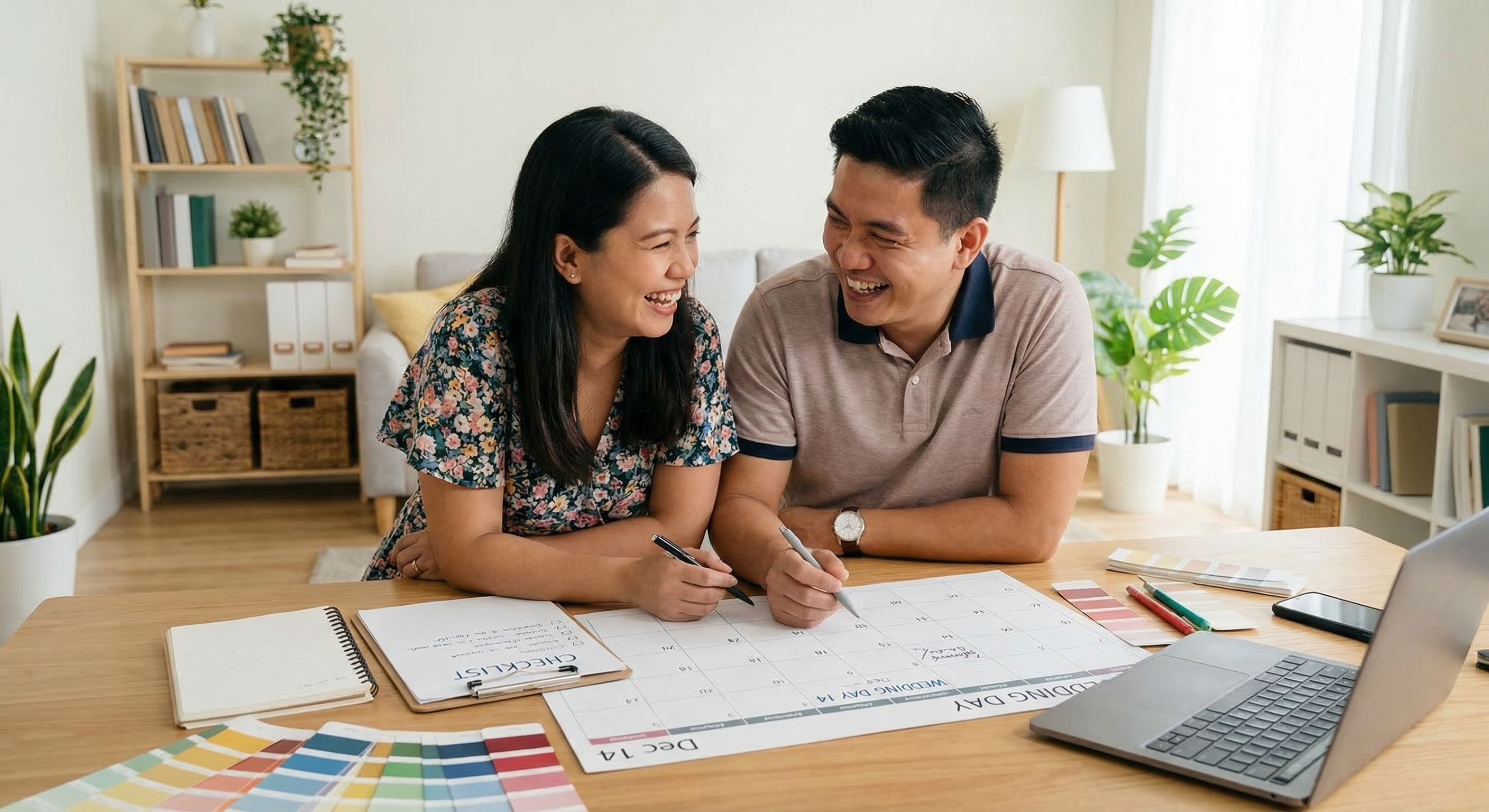 Filipino couple planning wedding with calendar and checklist